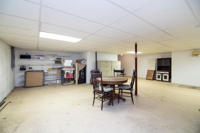 dining space featuring a drop ceiling