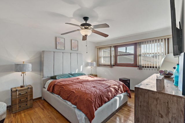 bedroom featuring light hardwood / wood-style floors and ceiling fan