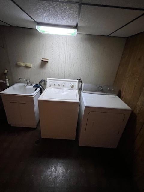 laundry area with washer and clothes dryer and sink