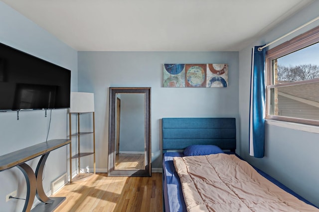 bedroom with wood-type flooring