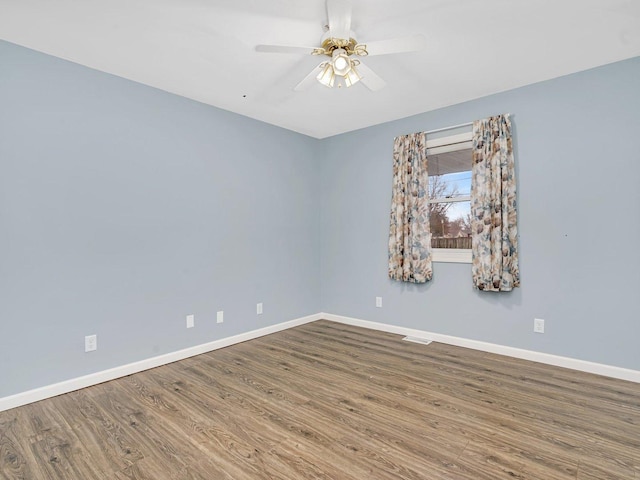 unfurnished room with wood-type flooring and ceiling fan