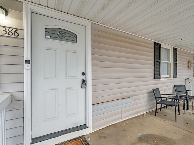 doorway to property featuring a porch