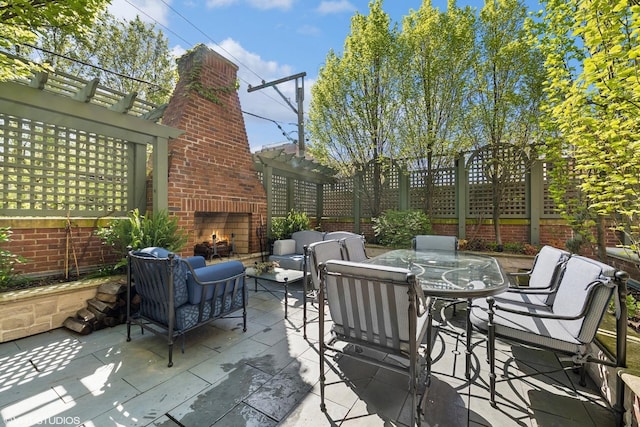 view of patio / terrace featuring an outdoor living space with a fireplace