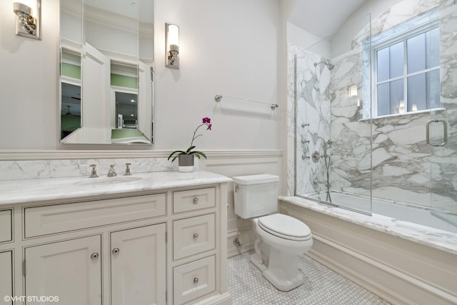 full bathroom featuring vanity, tile patterned floors, combined bath / shower with glass door, crown molding, and toilet