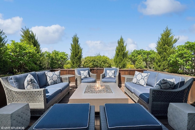 view of patio featuring an outdoor living space with a fire pit