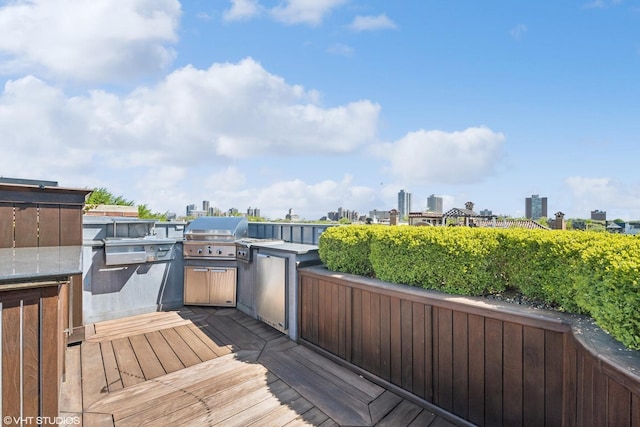 deck featuring an outdoor kitchen and grilling area