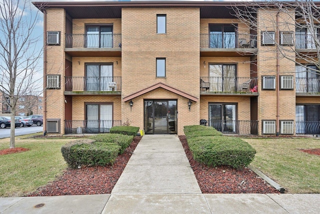 view of property with an AC wall unit