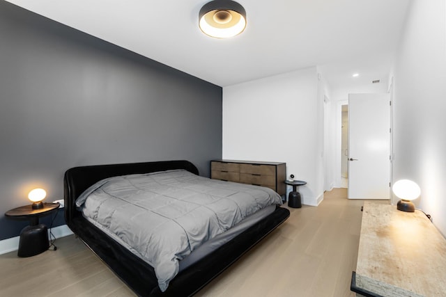 bedroom with light hardwood / wood-style floors