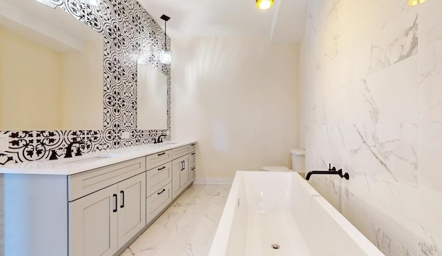 bathroom with a bathing tub, vanity, and tile walls