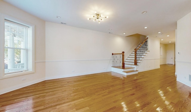 unfurnished living room with light wood-type flooring