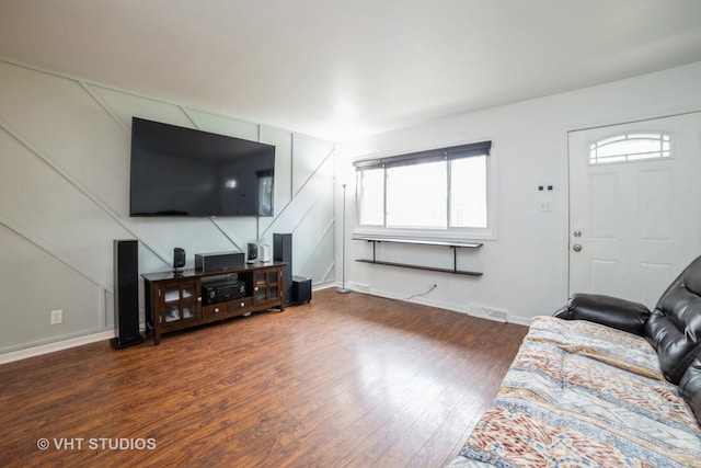 living room with dark hardwood / wood-style flooring