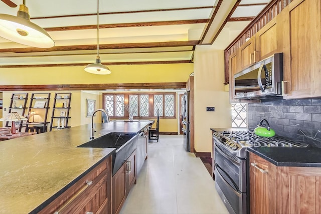 kitchen featuring stainless steel appliances, a sink, decorative backsplash, brown cabinets, and beamed ceiling