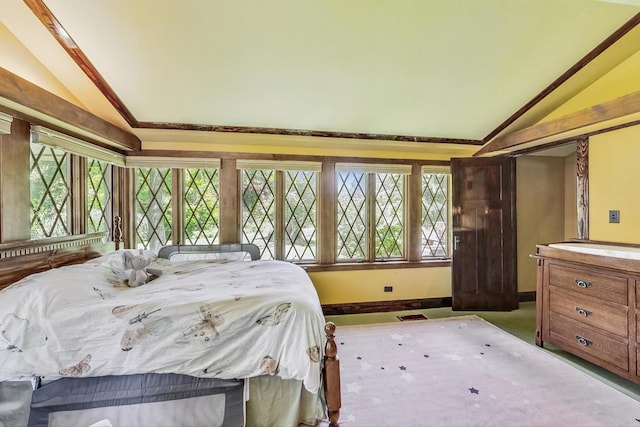 carpeted bedroom featuring vaulted ceiling, visible vents, and baseboards