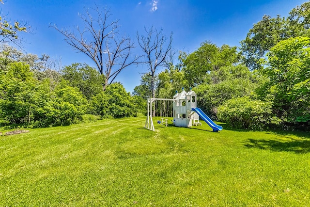 view of jungle gym with a lawn