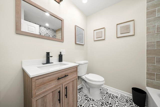 bathroom featuring tile patterned flooring, vanity, toilet, and a shower