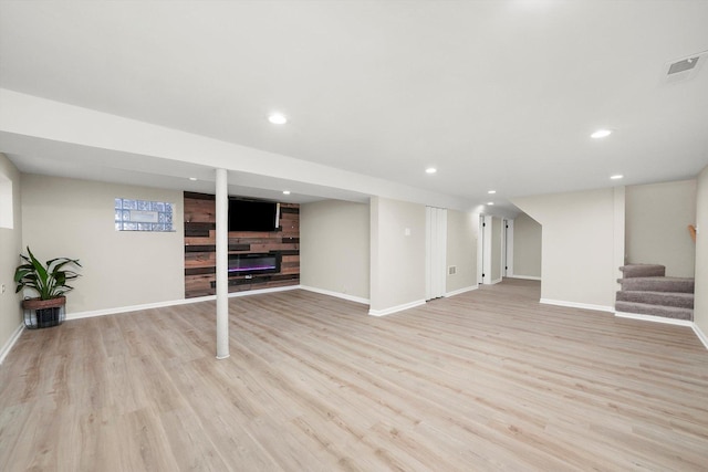 basement featuring light hardwood / wood-style floors