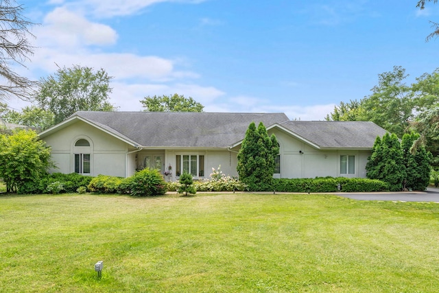 ranch-style home with a front yard