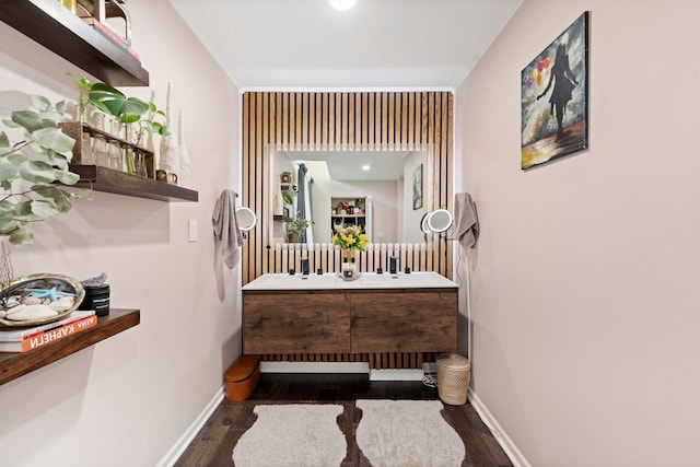 bathroom with hardwood / wood-style flooring and vanity