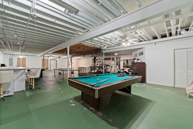 playroom with electric panel, concrete floors, and pool table