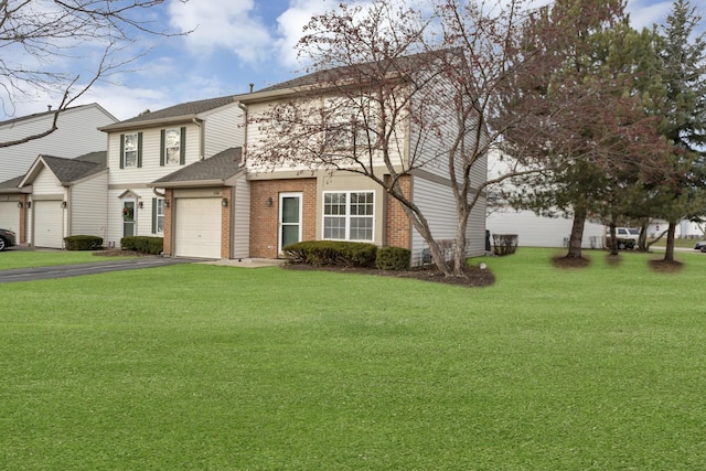 front facade featuring a garage and a front lawn