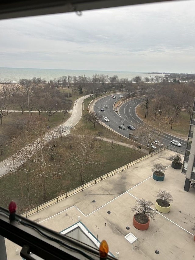 birds eye view of property with a water view