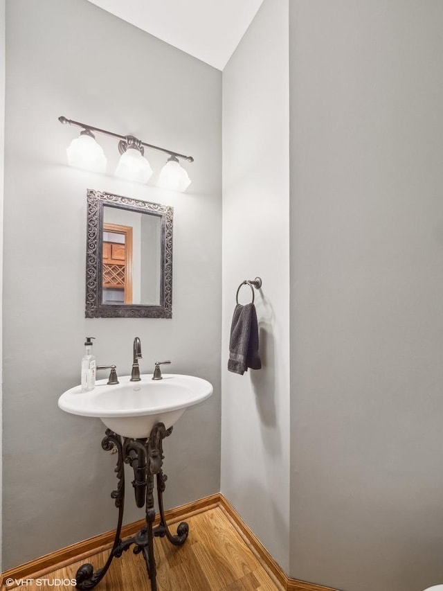 bathroom featuring hardwood / wood-style flooring and sink