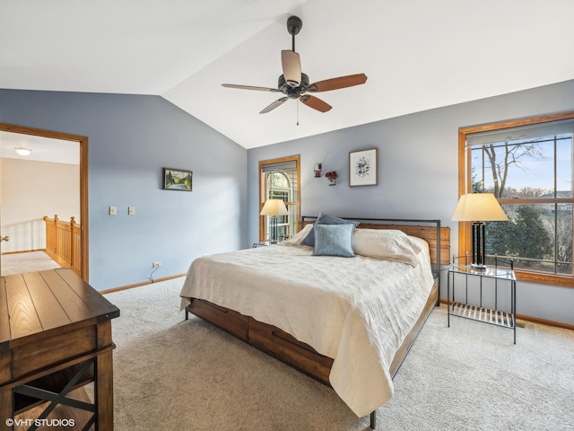 bedroom featuring carpet, vaulted ceiling, and ceiling fan