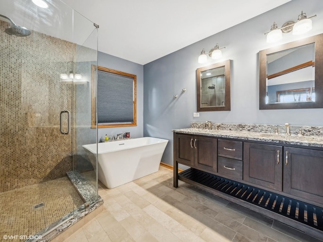 bathroom featuring separate shower and tub and vanity