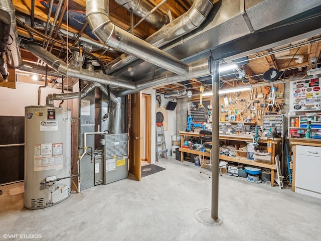 basement with a workshop area, heating unit, and gas water heater