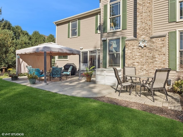 back of house featuring a lawn, a patio area, and outdoor lounge area