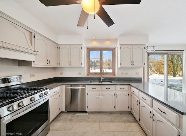 kitchen featuring plenty of natural light, stainless steel appliances, ceiling fan, and sink