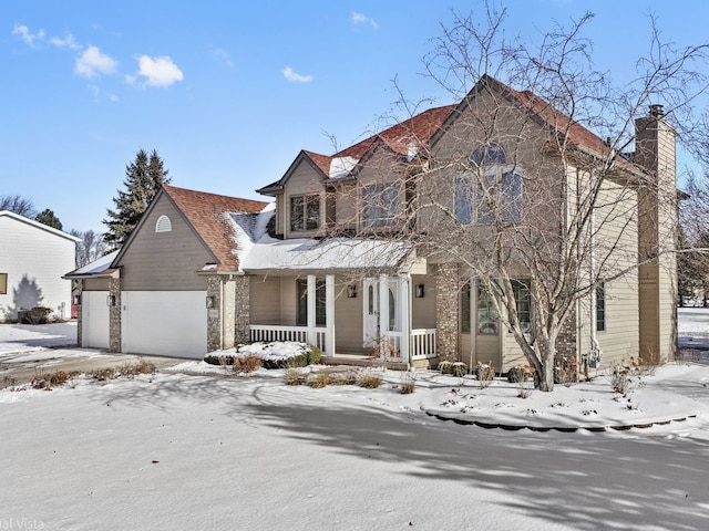 view of front of property with a porch and a garage