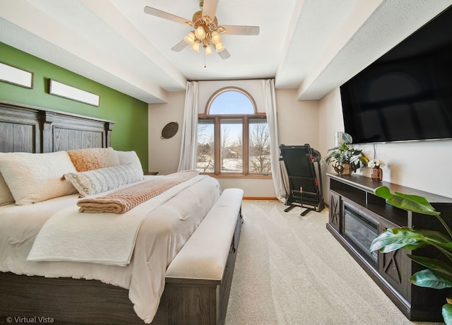 bedroom featuring ceiling fan and light colored carpet