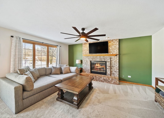 carpeted living room with a textured ceiling, ceiling fan, and a brick fireplace