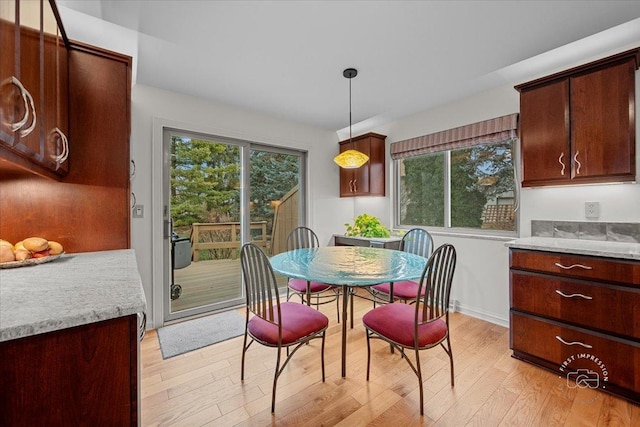 dining area with light hardwood / wood-style floors