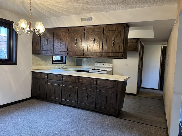 kitchen with a textured ceiling, dark brown cabinetry, white range with electric stovetop, decorative light fixtures, and a notable chandelier