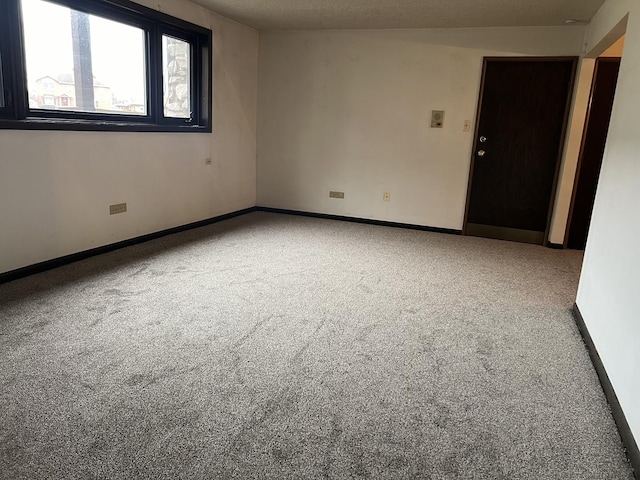 empty room featuring carpet floors