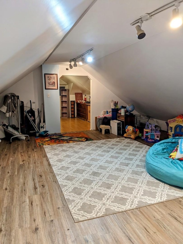 bonus room featuring hardwood / wood-style floors and vaulted ceiling