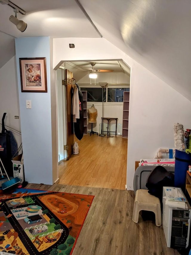 interior space with hardwood / wood-style floors and lofted ceiling