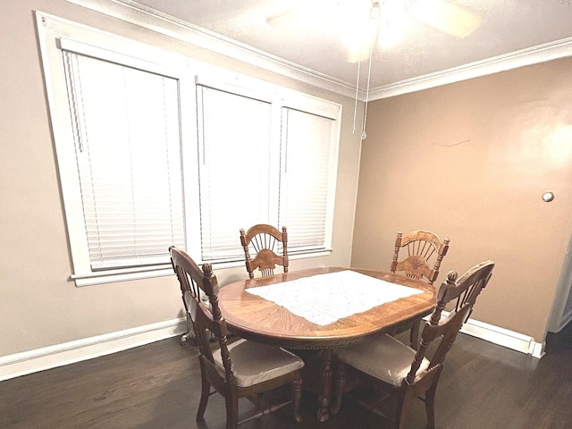 dining area featuring dark hardwood / wood-style floors, ceiling fan, and crown molding