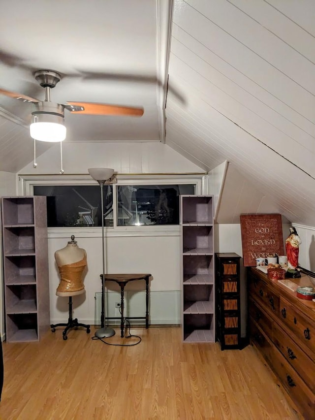 bonus room with light hardwood / wood-style flooring and vaulted ceiling