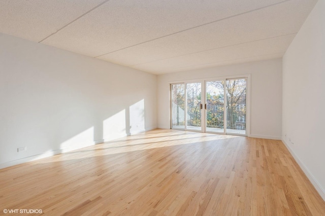 empty room with light wood-type flooring