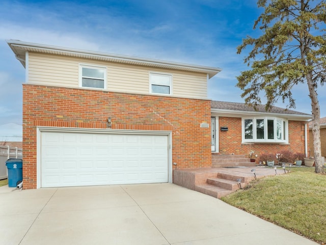 view of front of house with a front yard and a garage