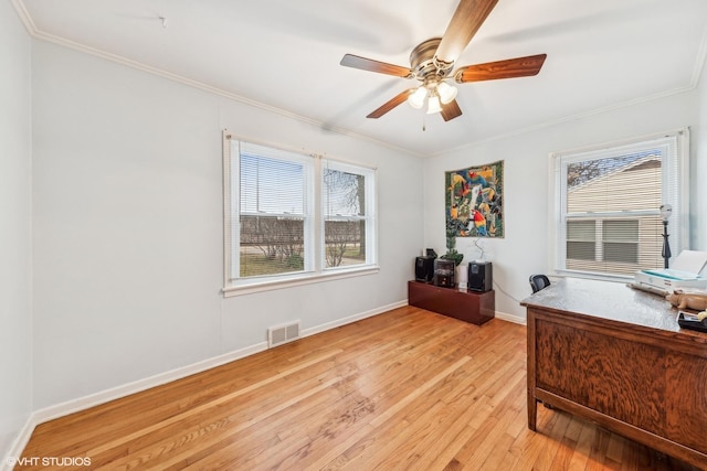 home office with ceiling fan, light hardwood / wood-style flooring, and crown molding