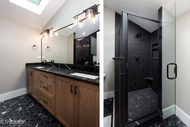 bathroom with vanity, an enclosed shower, and lofted ceiling with skylight