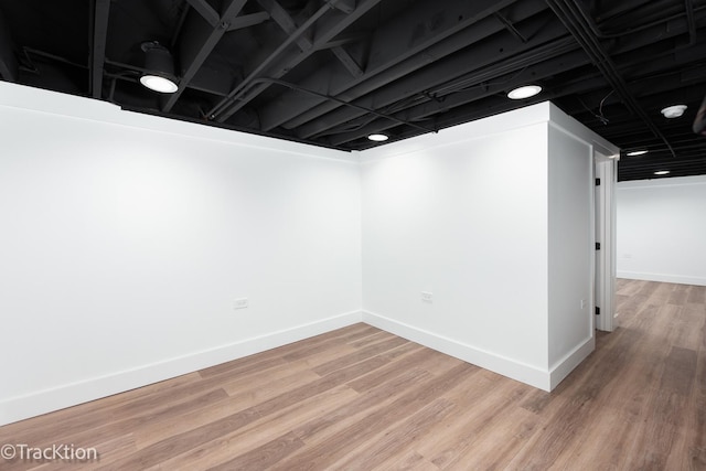 basement featuring hardwood / wood-style flooring