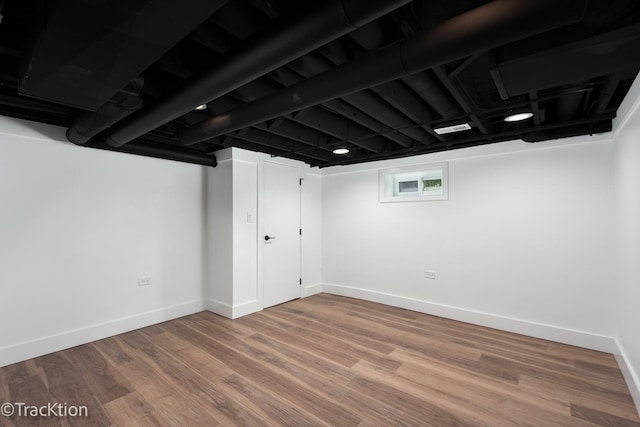 basement featuring hardwood / wood-style flooring