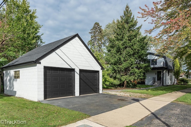 garage with a yard