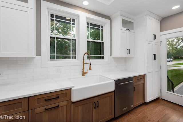 kitchen featuring white cabinets, dishwasher, a healthy amount of sunlight, and sink