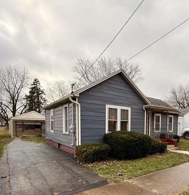 view of property exterior featuring an outbuilding